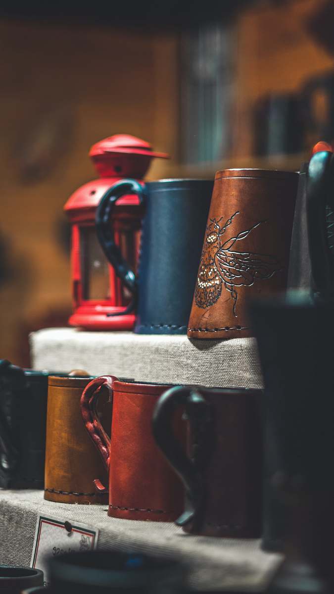 cup brown and black mugs on rack manchester